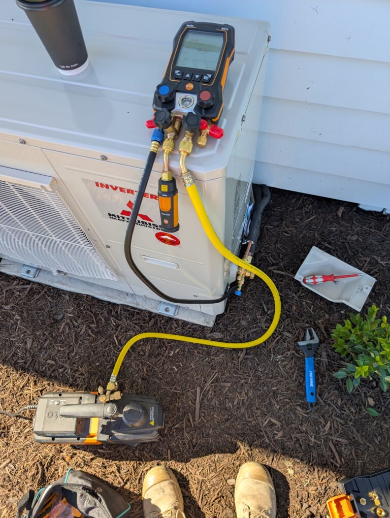 Testo digital manifold connected to split system AC unit for commissioning and pressure testing