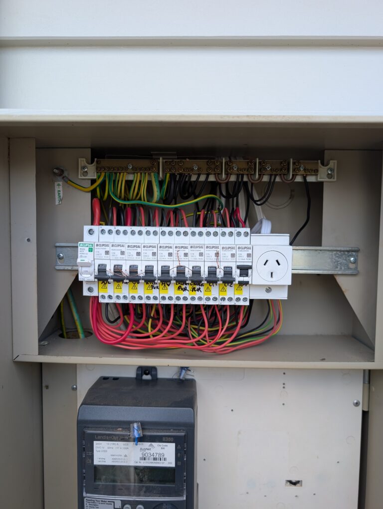 Residential outdoor switchboard with Clipsal circuit breakers and metering