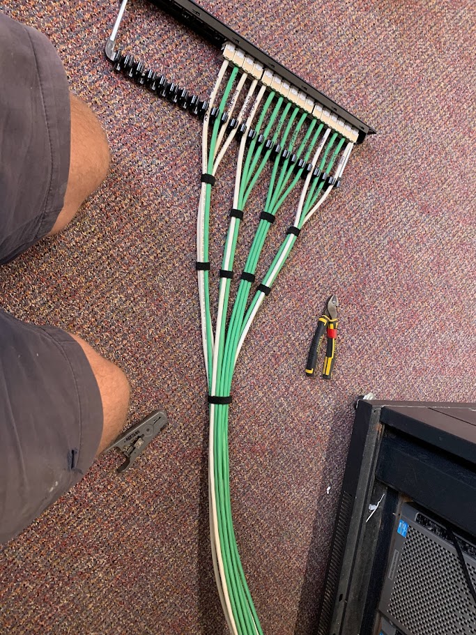Structured data cabling being terminated into a patch panel with velcro-tied bundles